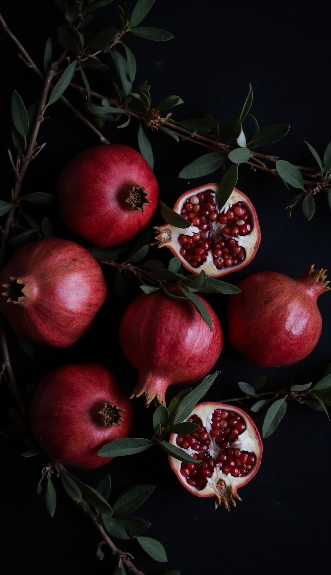 Soft,  diffused light from above illuminates five whole pomegranates with smooth,  slightly textured on Tensor.Art