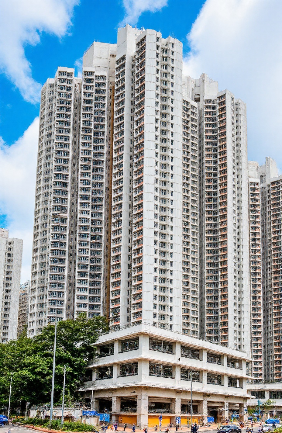 ((3 residential towers)) sitting on a large podium with shopping mall underneath. the whole building consists of following...