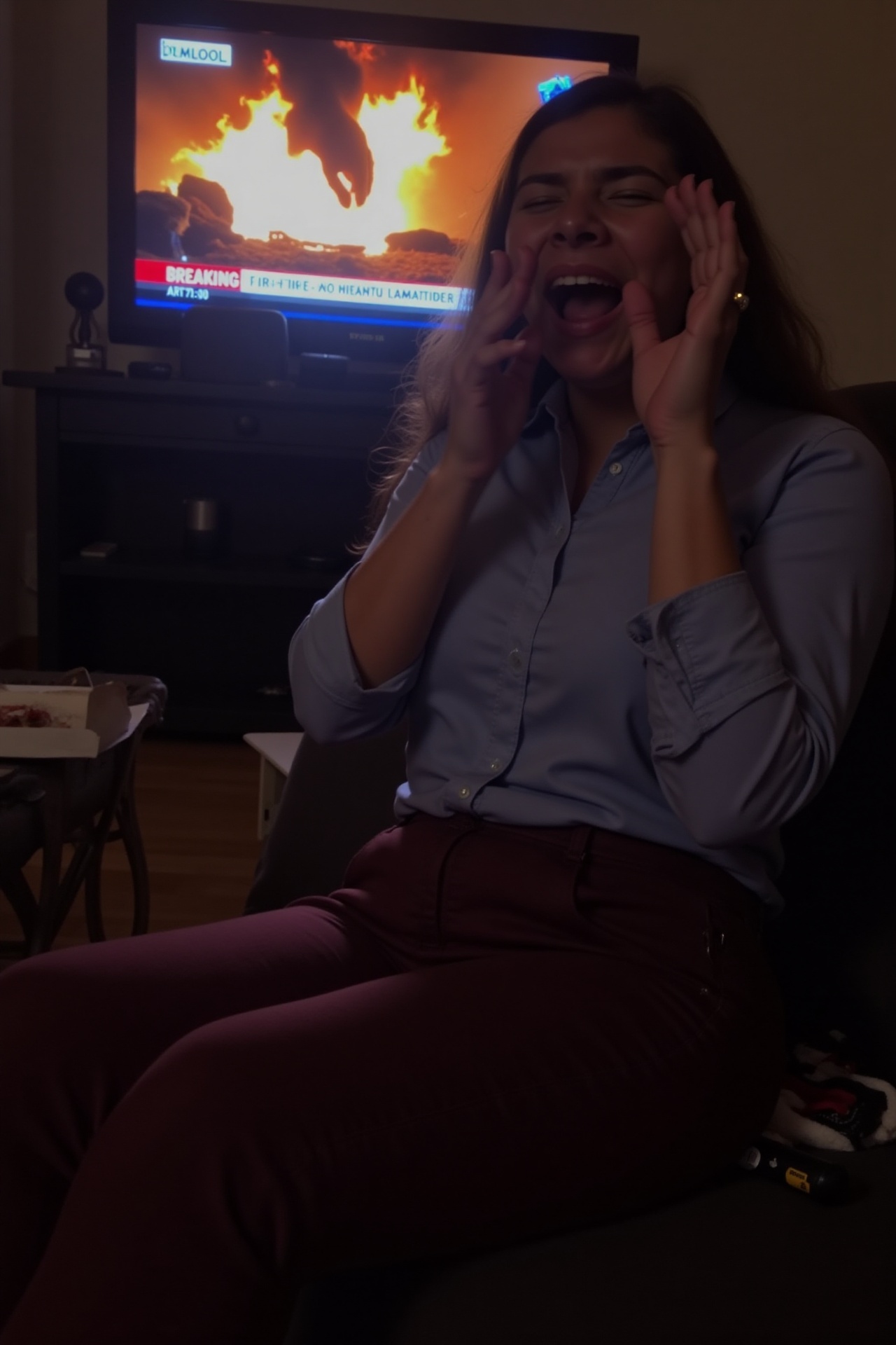 Taken by phone camera,  a woman caught mid-yawn while sitting on a sofa. The photo is slightly blurry,  with motion blur o...