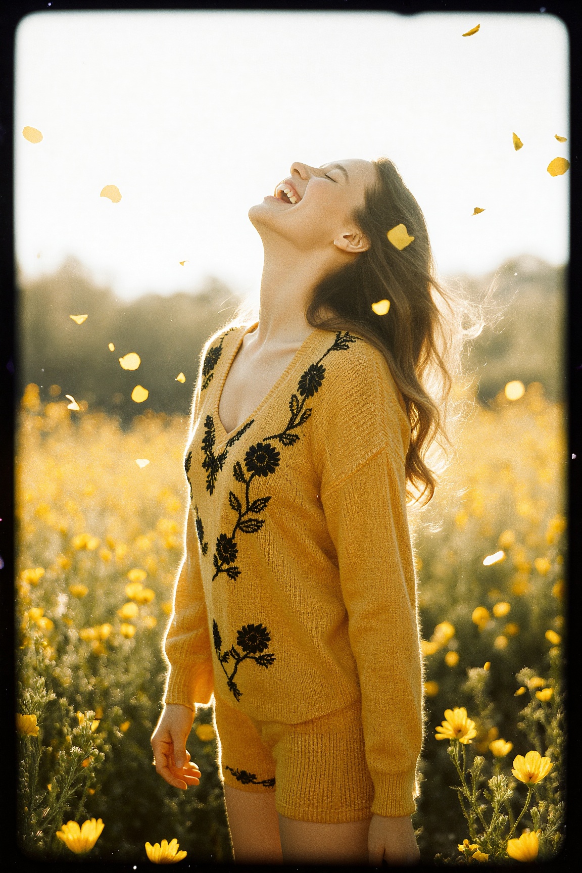 A joyful woman stands in the middle of a sun-drenched field of yellow wildflowers,  wearing a soft mustard-yellow knit set...