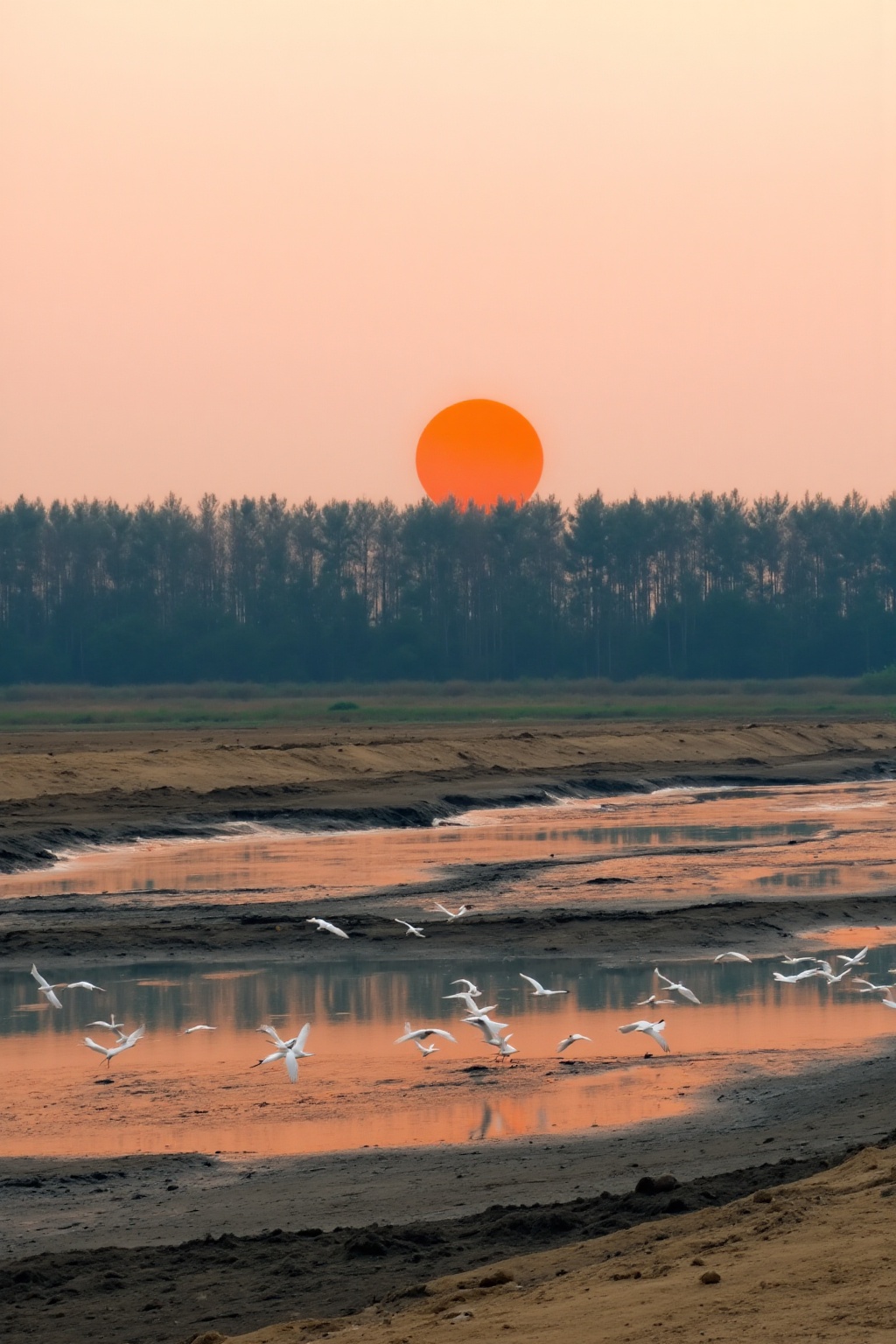 The image depicts a serene natural scene at sunset. A large orange sun is setting in the background,  casting a warm glow...