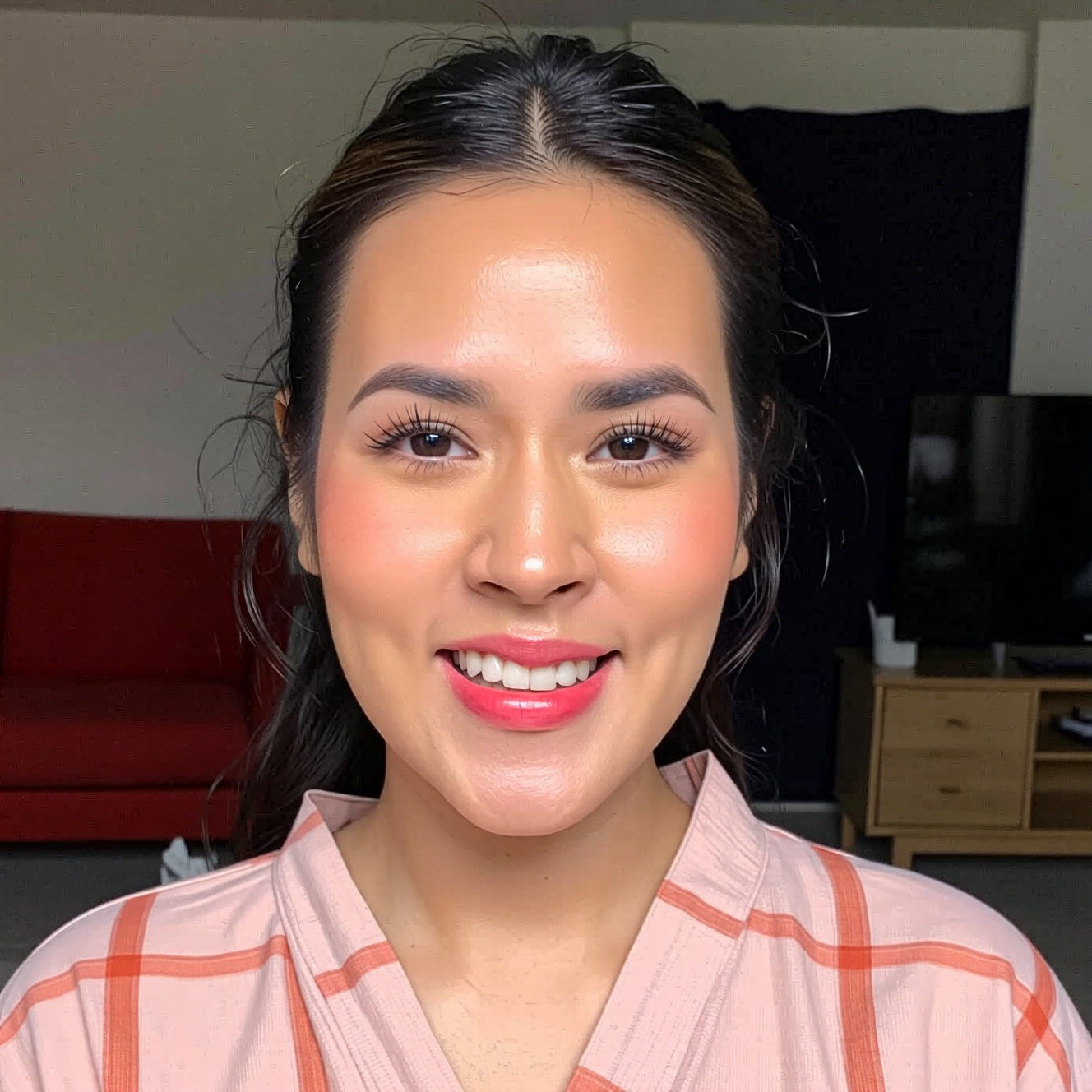 a photo of a r4is4 woman captured in a brightly lit,  close-up portrait,  looking directly at the camera with a warm and r...