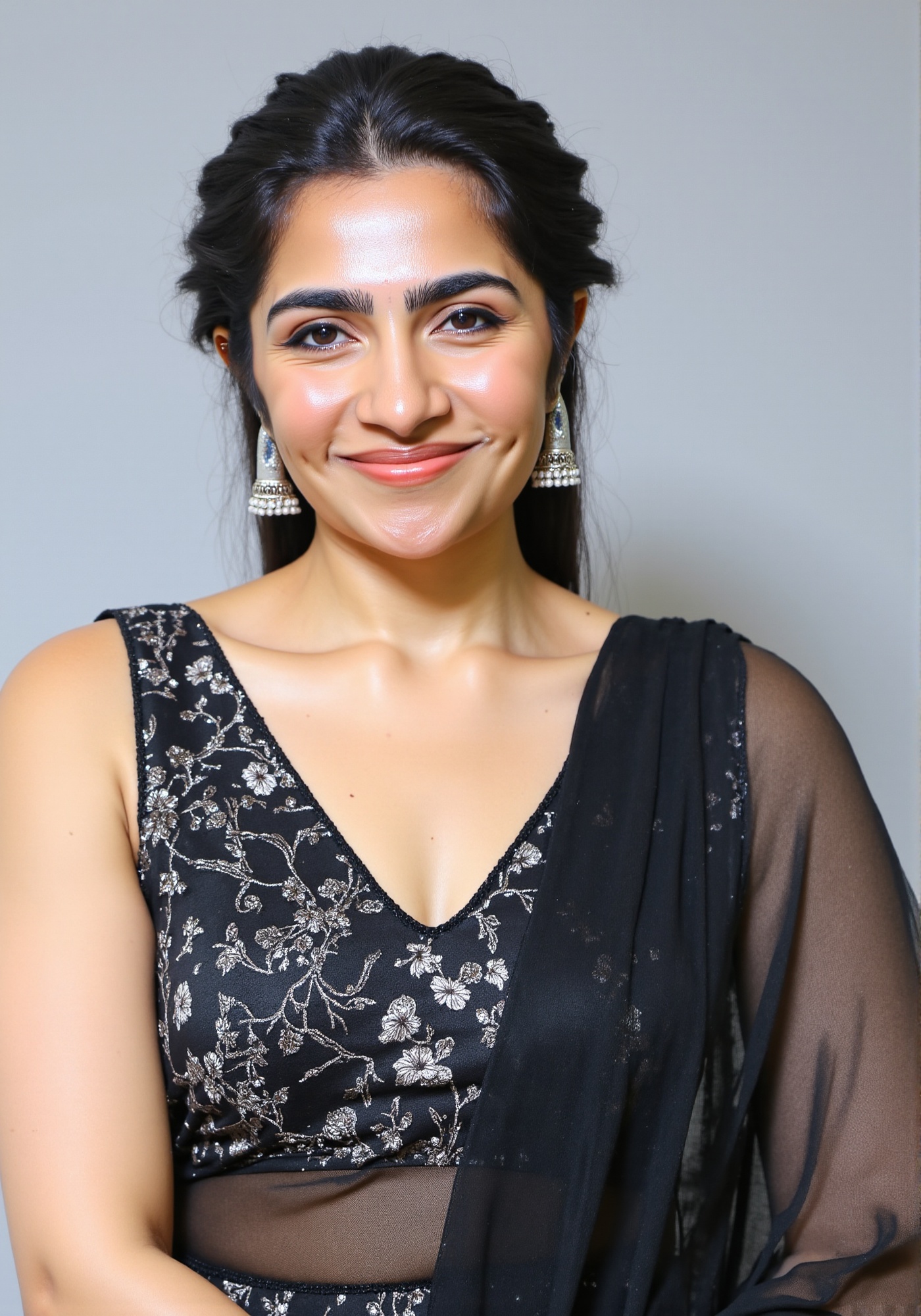 A upper body shot of woman wearing a black deep-neck sleeveless embroidered kurta with intricate floral designs. clevage,...