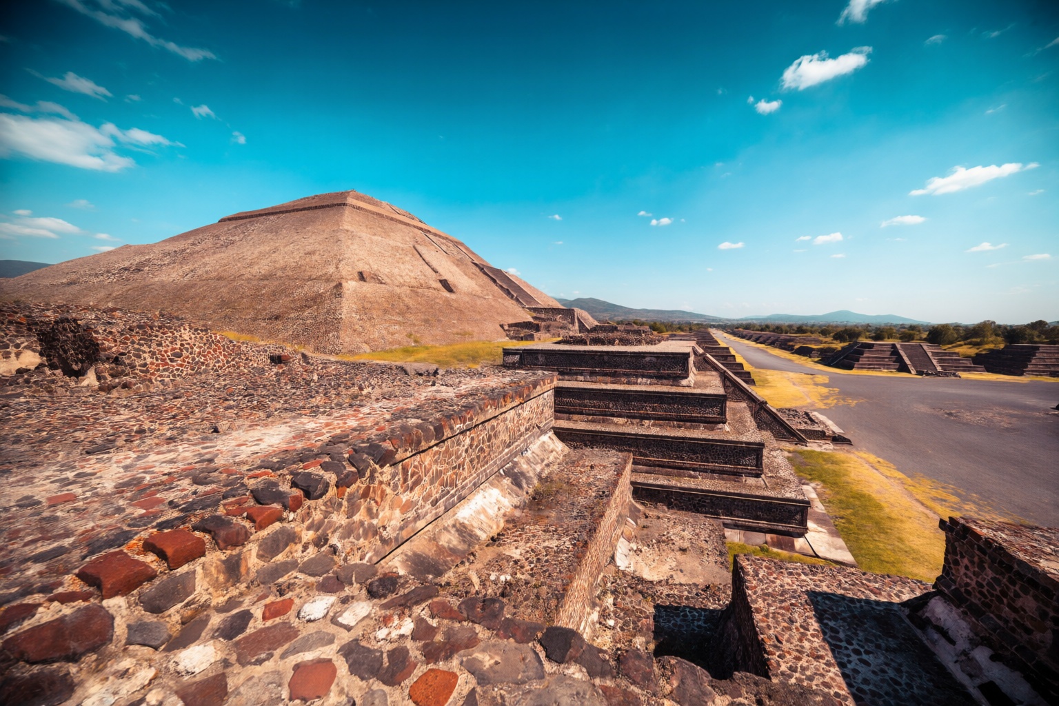 aurelmanea2q photography. A grand,  imposing wide-angle landscape shot focusing on the Pyramid of the Sun,  the largest st...