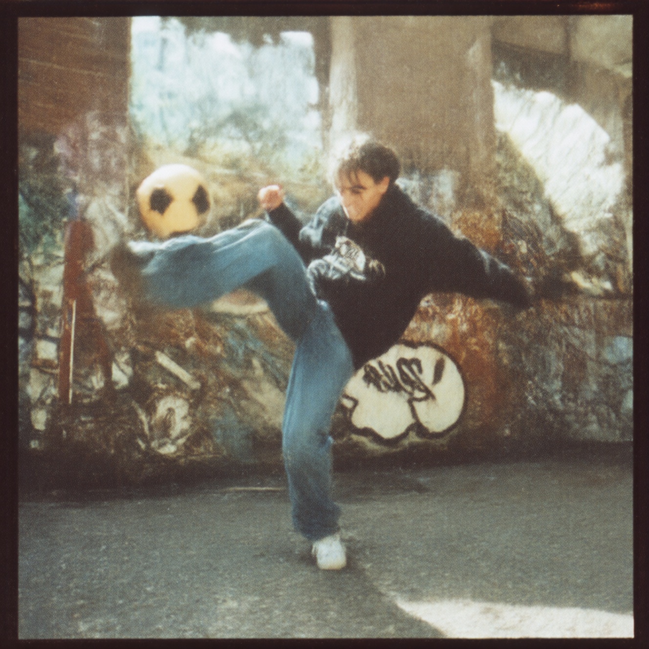 90zVibez ,  A nostalgic 90s candid photo of a teenager doing a kickflip on a sidewalk,  wearing baggy jeans and a hoodie o...