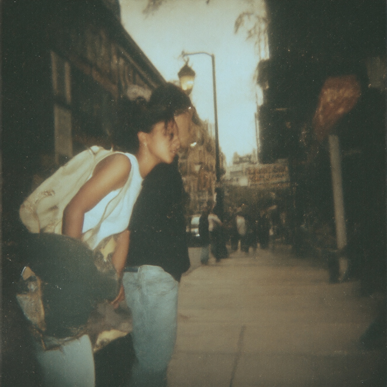 90zVibez,  A 90s urban candid photo of a skater cruising down a city street,  backpack slung over shoulder on Tensor.Art